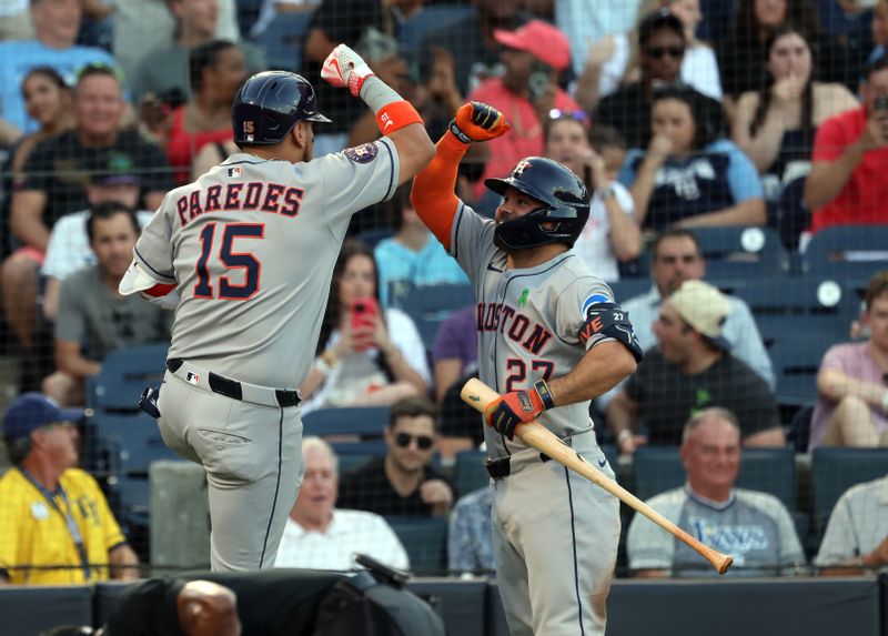 May 20, 2025; St. Petersburg, Florida, USA; Houston Astros third base Isaac Paredes (15) is congratulated by outfielder Jose Altuve (27) after he hit a home run against the Tampa Bay Rays during the third inning at George M. Steinbrenner Field. Mandatory Credit: Kim Klement Neitzel-Imagn Images