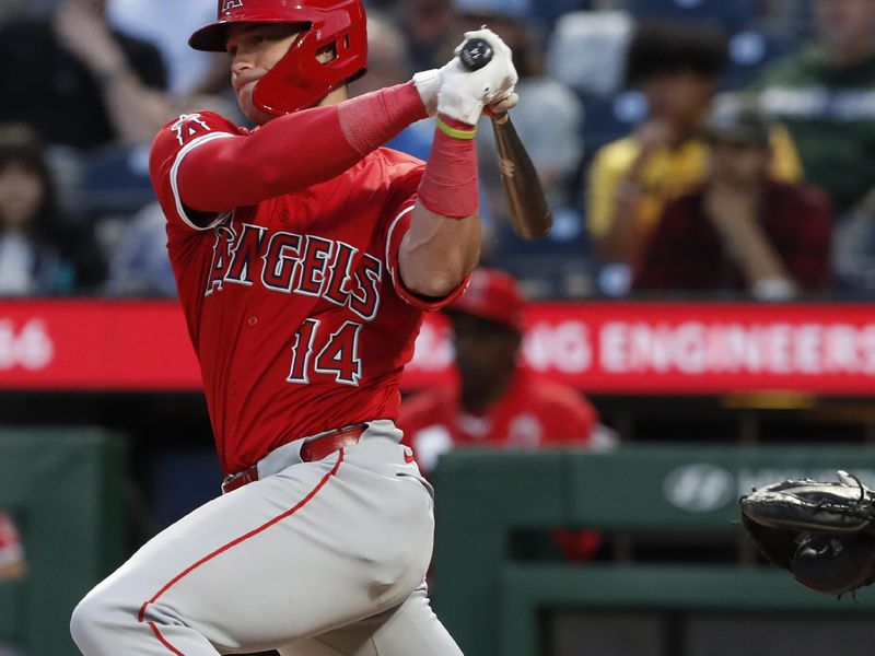 May 7, 2024; Pittsburgh, Pennsylvania, USA;  Los Angeles Angels catcher Logan O'Hoppe (14) hits an RBI single against the Pittsburgh Pirates during the fifth inning at PNC Park. Mandatory Credit: Charles LeClaire-USA TODAY Sports