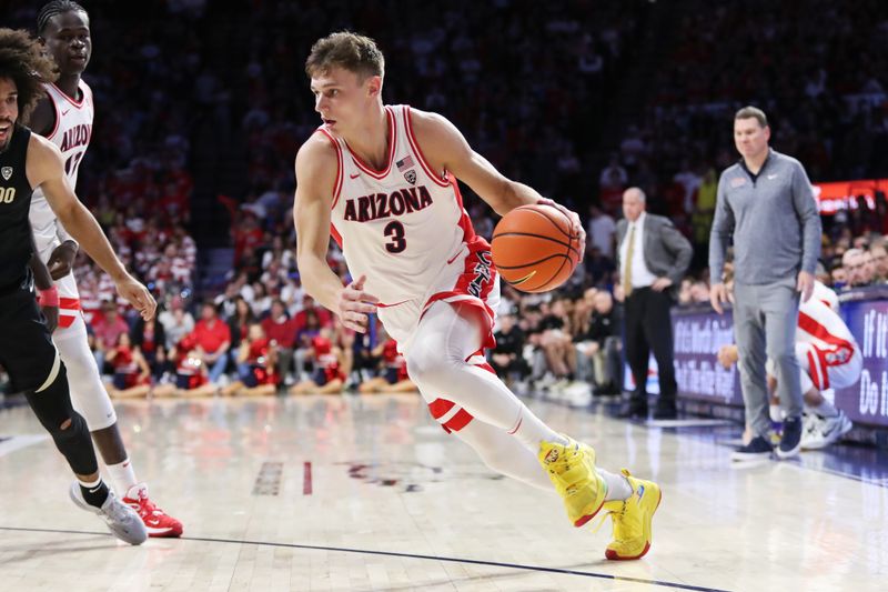 Feb 18, 2023; Tucson, Arizona, USA; Arizona Wildcats guard Pelle Larsson (3) drives to the net against Colorado Buffaloes guard Javon Ruffin (11) during the second half at McKale Center. Mandatory Credit: Zachary BonDurant-USA TODAY Sports