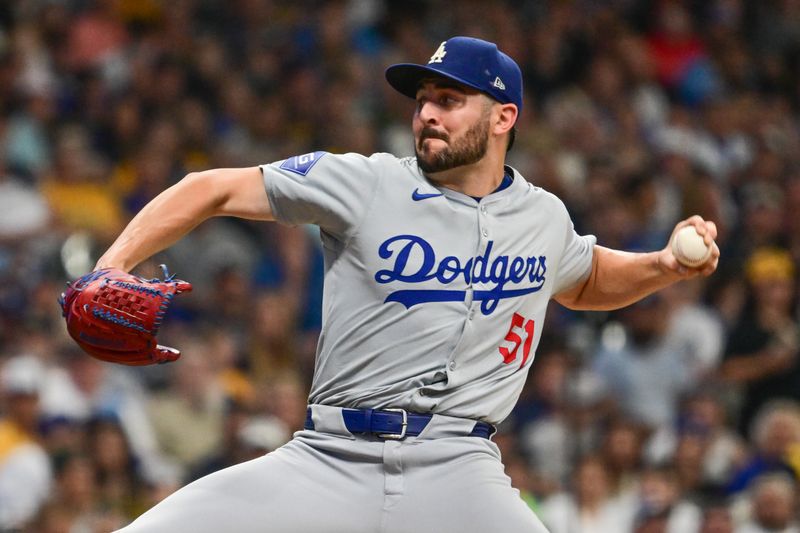 Aug 15, 2024; Milwaukee, Wisconsin, USA; Los Angeles Dodgers relief pitcher Alex Vesia (51) throws against the Milwaukee Brewers in the seventh inning at American Family Field. Mandatory Credit: Benny Sieu-USA TODAY Sports