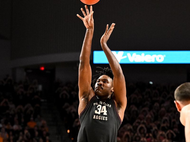 Feb 21, 2023; College Station, Texas, USA;  Texas A&M Aggies forward Julius Marble (34) shoots a free throw during the second half against the Tennessee Volunteers at Reed Arena. Mandatory Credit: Maria Lysaker-USA TODAY Sports