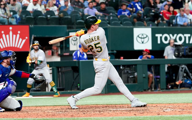 Apr 30, 2025; Arlington, Texas, USA;  Oakland Athletics designated hitter Brent Rooker (25) hits a two-run home run during the ninth inning against the Texas Rangers at Globe Life Field. Mandatory Credit: Kevin Jairaj-Imagn Images