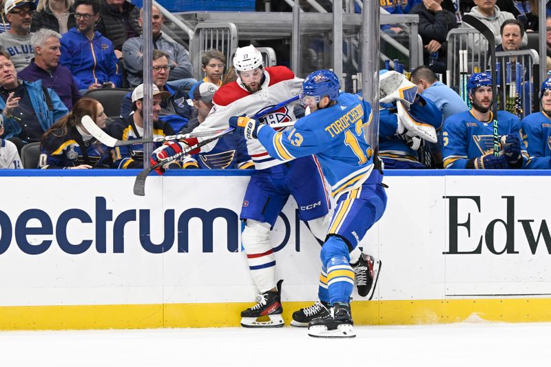 Nov 4, 2023; St. Louis, Missouri, USA; St. Louis Blues right wing Alexey Toropchenko (13) checks Montreal Canadiens right wing Josh Anderson (17) during the third period at Enterprise Center. Mandatory Credit: Jeff Le-USA TODAY Sports