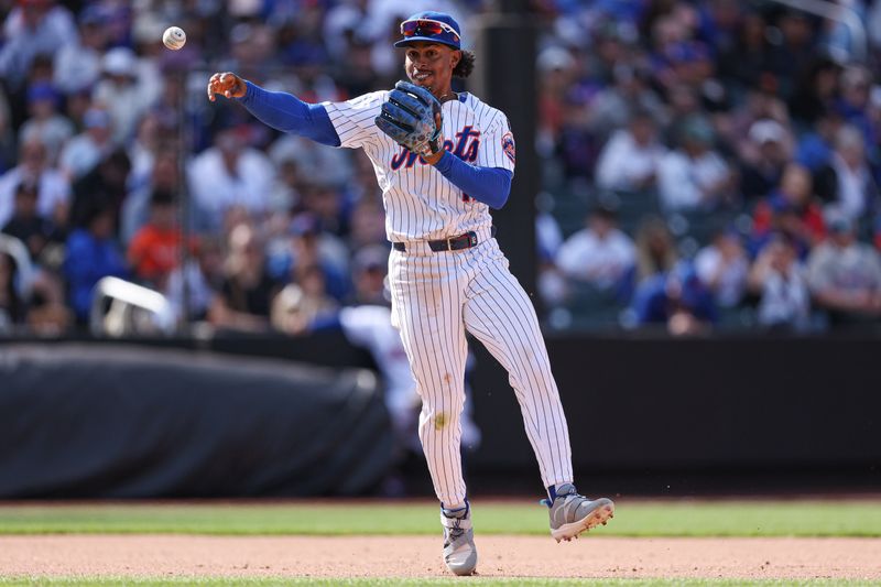 Apr 20, 2025; New York City, New York, USA; New York Mets shortstop Francisco Lindor (12) throws the ball to first base for an out during the eighth inning against the St. Louis Cardinals at Citi Field. Mandatory Credit: Vincent Carchietta-Imagn Images