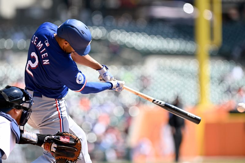 Apr 18, 2024; Detroit, Michigan, USA;  Texas Rangers second base Marcus Semien (2) hits a single against the Detroit Tigers in the second inning at Comerica Park. Mandatory Credit: Lon Horwedel-USA TODAY Sports