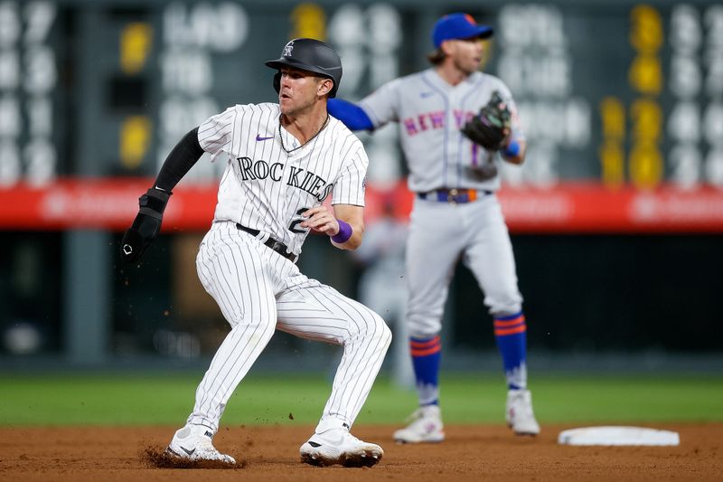 May 26, 2023; Denver, Colorado, USA; Colorado Rockies first baseman Nolan Jones (22) halts between second and third base in the ninth inning against the New York Mets at Coors Field. Mandatory Credit: Isaiah J. Downing-USA TODAY Sports