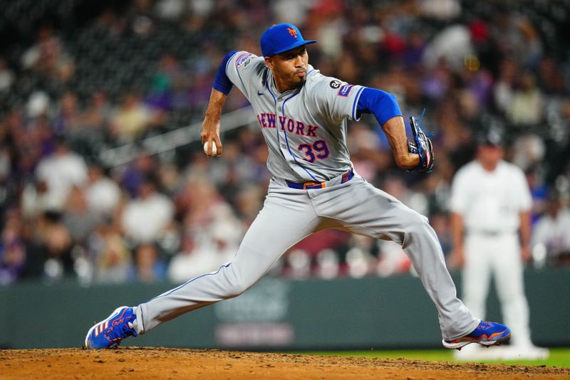 Aug 7, 2024; Denver, Colorado, USA; New York Mets relief pitcher Edwin Diaz (39) delivers a pitch in the ninth inning against the Colorado Rockies at Coors Field. Mandatory Credit: Ron Chenoy-USA TODAY Sports