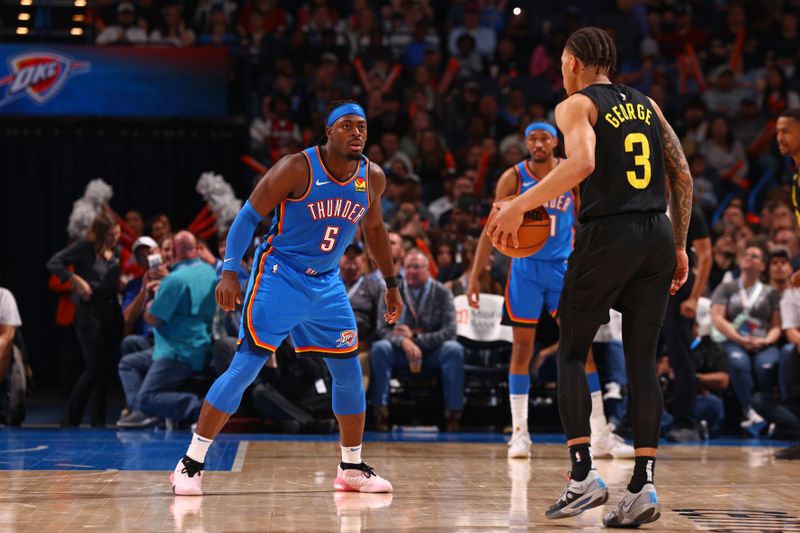 OKLAHOMA CITY, OK - MARCH 20: Luguentz Dort #5 of the Oklahoma City Thunder plays defense during the game against the Utah Jazz on March 20, 2024 at Paycom Arena in Oklahoma City, Oklahoma. NOTE TO USER: User expressly acknowledges and agrees that, by downloading and or using this photograph, User is consenting to the terms and conditions of the Getty Images License Agreement. Mandatory Copyright Notice: Copyright 2024 NBAE (Photo by Zach Beeker/NBAE via Getty Images)