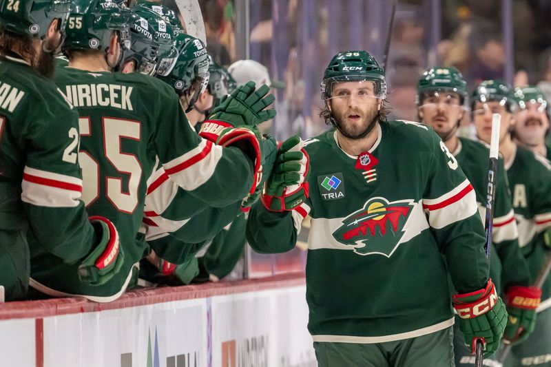 Jan 15, 2025; Saint Paul, Minnesota, USA;  Minnesota Wild forward Ryan Hartman (38) celebrates his goal against the Edmonton Oilers during the second period at Xcel Energy Center. Mandatory Credit: Nick Wosika-Imagn Images

