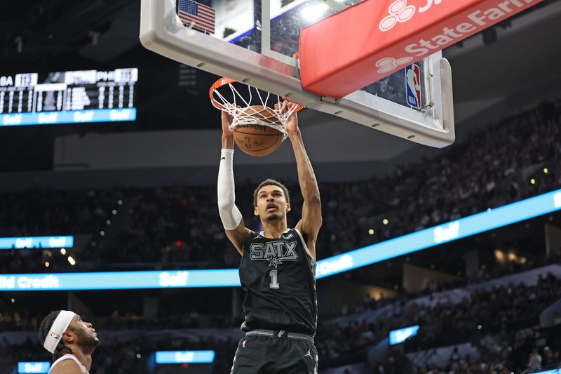 SAN ANTONIO, TX - APRIL 7: (EDITORS NOTE: Sequence 3 of 3) Victor Wembanyama #1 of the San Antonio Spurs dunks the ball during the game against the Philadelphia 76ers on April 7, 2024 at the Frost Bank Center in San Antonio, Texas. NOTE TO USER: User expressly acknowledges and agrees that, by downloading and or using this photograph, user is consenting to the terms and conditions of the Getty Images License Agreement. Mandatory Copyright Notice: Copyright 2024 NBAE (Photos by Tim Heitman/NBAE via Getty Images)