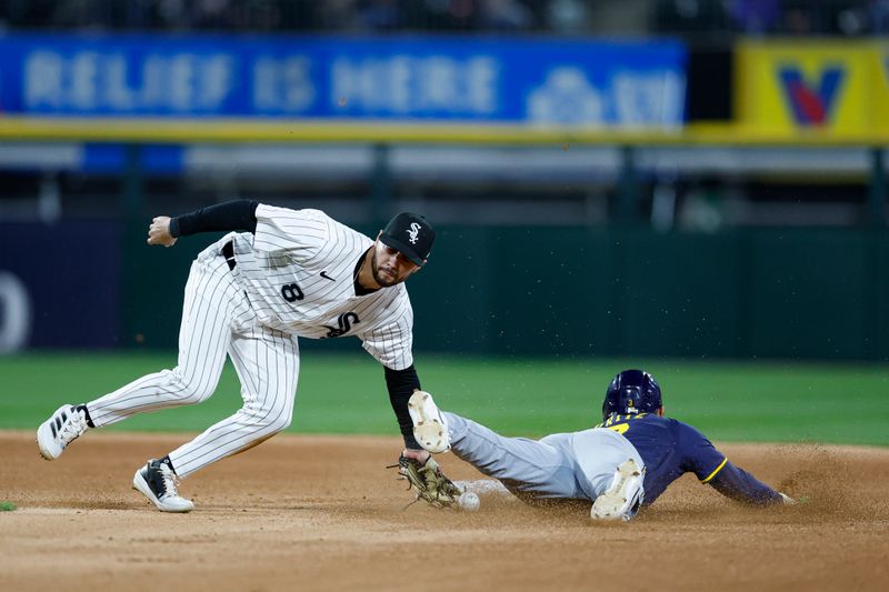 Apr 29, 2025; Chicago, Illinois, USA; Milwaukee Brewers shortstop Joey Ortiz (3) steals second base against Chicago White Sox shortstop Jacob Amaya (8) during the sixth inning at Rate Field. Mandatory Credit: Kamil Krzaczynski-Imagn Images