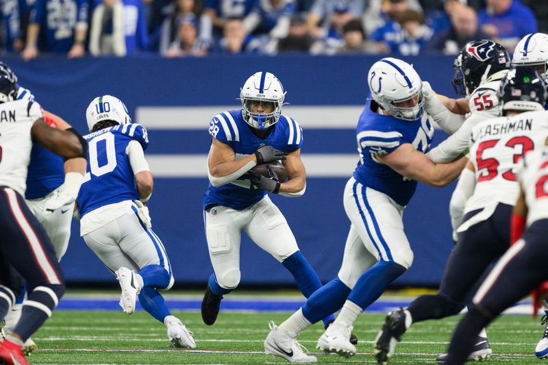 Indianapolis Colts running back Jonathan Taylor (28) cuts to the inside during an NFL football game against the Houston Texans, Saturday, Jan. 6, 2024, in Indianapolis. (AP Photo/Zach Bolinger)