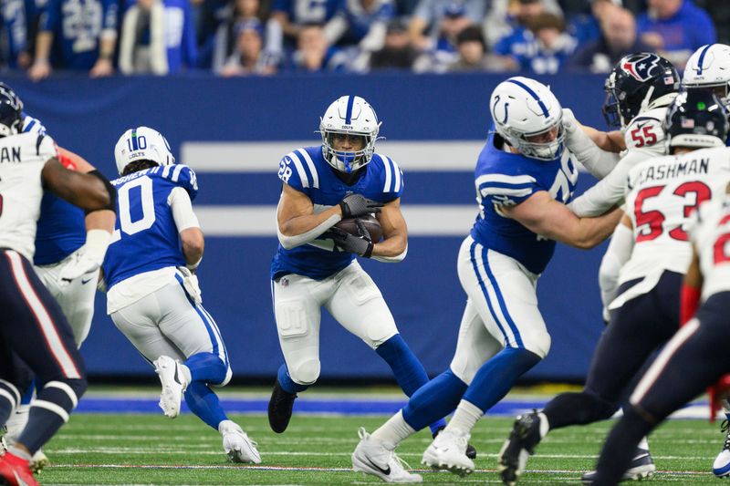 Indianapolis Colts running back Jonathan Taylor (28) cuts to the inside during an NFL football game against the Houston Texans, Saturday, Jan. 6, 2024, in Indianapolis. (AP Photo/Zach Bolinger)