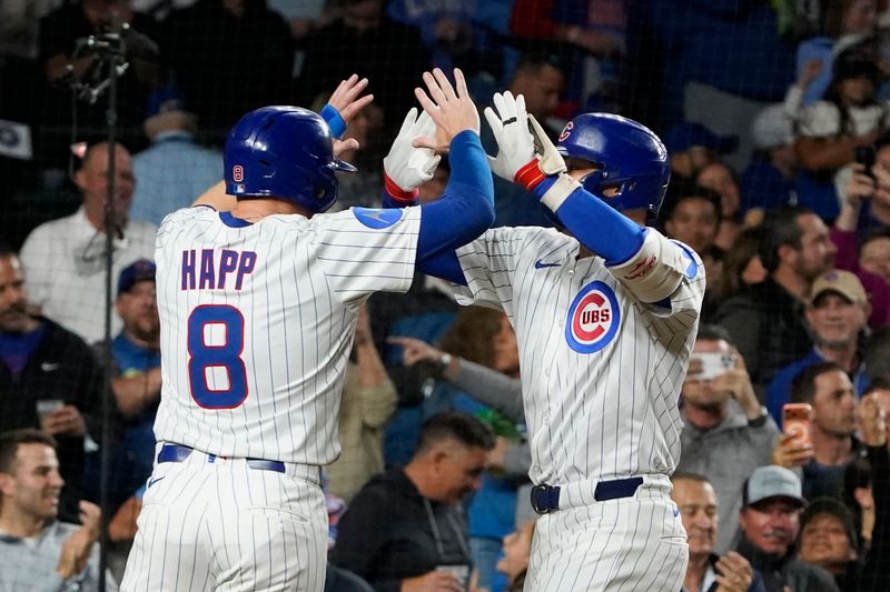 Sep 25, 2025; Chicago, Illinois, USA; Chicago Cubs outfielder Seiya Suzuki (27) tis greeted by outfielder Ian Happ (8) after hitting a three-run home run against the New York Mets during the sixth inning at Wrigley Field. Mandatory Credit: David Banks-Imagn Images