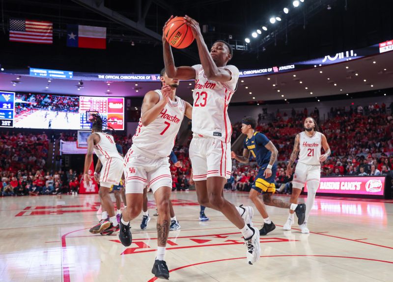 Jan 15, 2025; Houston, Texas, USA; Houston Cougars guard Terrance Arceneaux (23) grabs a rebound against the West Virginia Mountaineers in the first half at Fertitta Center. Mandatory Credit: Thomas Shea-Imagn Images