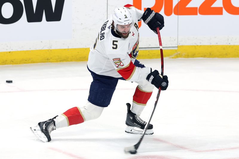 Jan 22, 2026; Winnipeg, Manitoba, CAN; Florida Panthers defenseman Aaron Ekblad (5) warms up before a game against the Winnipeg Jets at Canada Life Centre. Mandatory Credit: James Carey Lauder-Imagn Images