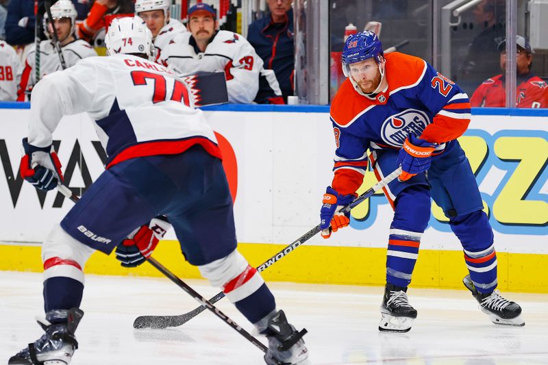 Mar 13, 2024; Edmonton, Alberta, CAN; Edmonton Oilers forward Connor Brown (28) looks to take a shot in front of Washington Capitals defensemen John Carlson (74) during the third period at Rogers Place. Mandatory Credit: Perry Nelson-USA TODAY Sports