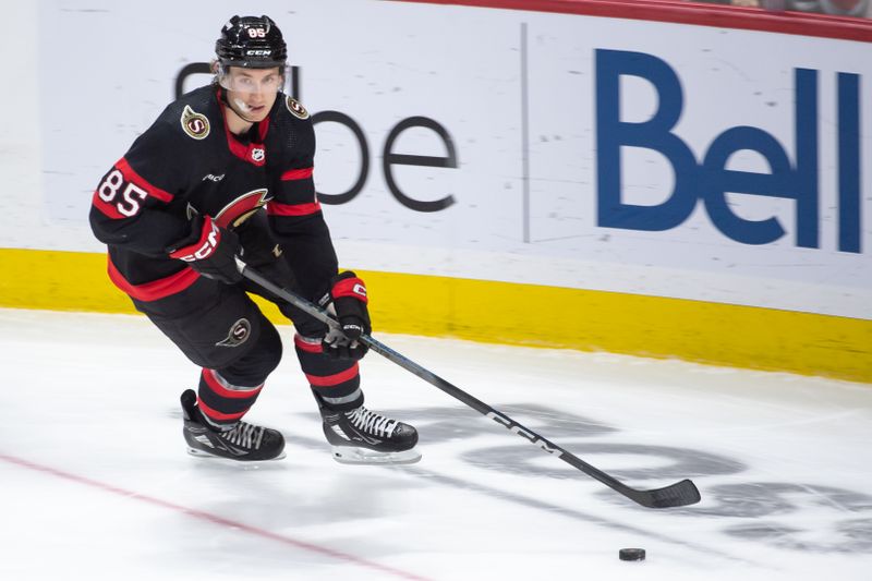 Apr 6, 2024; Ottawa, Ontario, CAN; Ottawa Senators defenseman Jake Sanderson (85) skates with the puck in the third period against the New Jersey Devils at the Canadian Tire Centre. Mandatory Credit: Marc DesRosiers-USA TODAY Sports