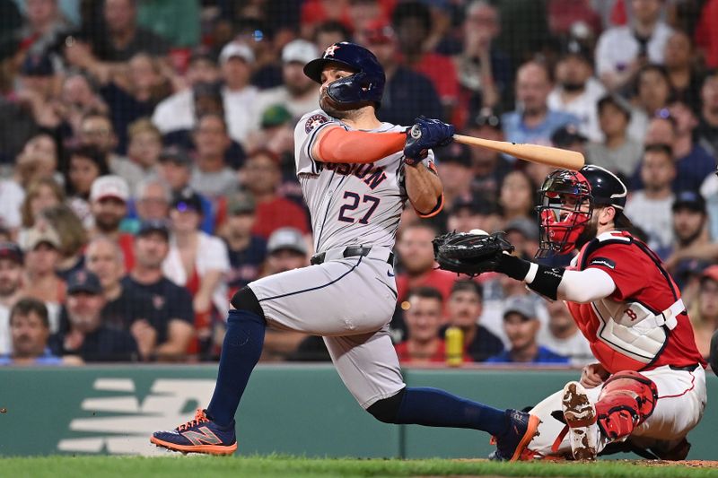 Aug 9, 2024; Boston, Massachusetts, USA; Houston Astros second baseman Jose Altuve (27) hits a two-run home run during the seventh inning against the Boston Red Sox at Fenway Park. Mandatory Credit: Eric Canha-USA TODAY Sports