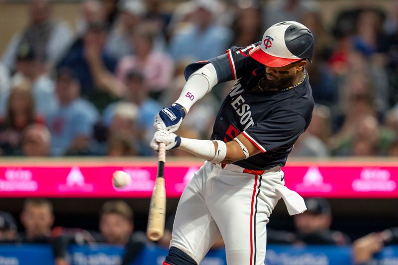 Sep 25, 2024; Minneapolis, Minnesota, USA; Minnesota Twins left fielder Willi Castro (50) hits a double against the Miami Marlins in the third inning at Target Field. Mandatory Credit: Jesse Johnson-Imagn Images