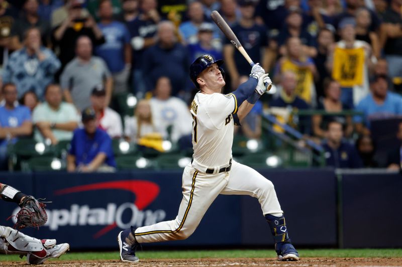 Oct 4, 2023; Milwaukee, Wisconsin, USA; Milwaukee Brewers player Mark Canha (21) hits a single in eighth inning against the Arizona Diamondbacks during game two of the Wildcard series for the 2023 MLB playoffs at American Family Field. Mandatory Credit: Kamil Krzaczynski-USA TODAY Sports