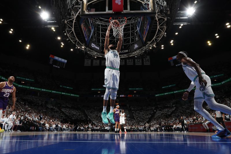 MINNEAPOLIS, MN -  APRIL 23: Rudy Gobert #27 of the Minnesota Timberwolves dunks the ball during the game against the Phoenix Suns during Round One Game Two of the 2024 NBA Playoffs on April 23, 2024 at Target Center in Minneapolis, Minnesota. NOTE TO USER: User expressly acknowledges and agrees that, by downloading and or using this Photograph, user is consenting to the terms and conditions of the Getty Images License Agreement. Mandatory Copyright Notice: Copyright 2024 NBAE (Photo by Jordan Johnson/NBAE via Getty Images)