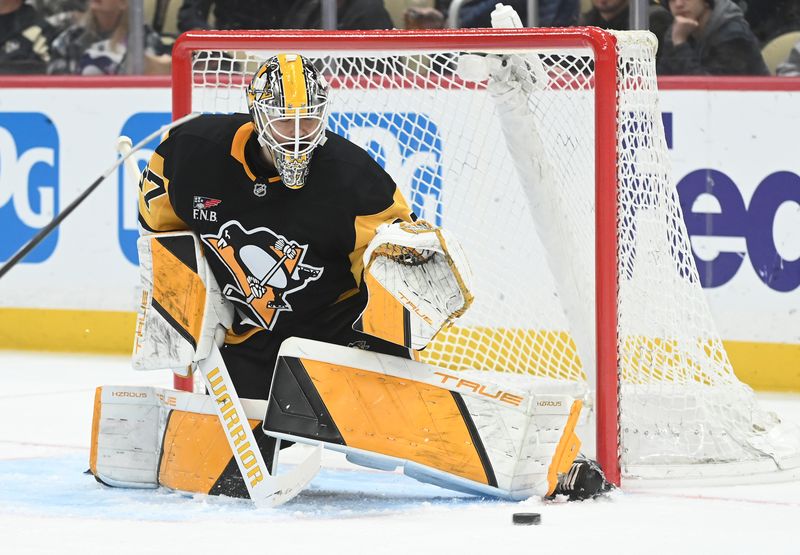 Jan 10, 2026; Pittsburgh, Pennsylvania, USA;  Pittsburgh Penguins goalie Arturs Silovs (37)  blocks a shot during the second period against the Calgary Flames shot at PPG Paints Arena. Mandatory Credit: Philip G. Pavely-Imagn Images