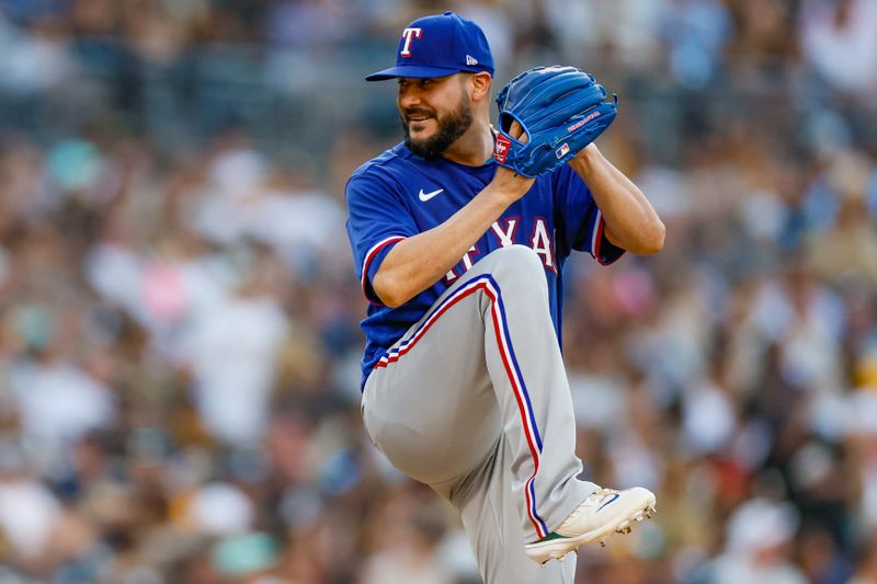 Jul 29, 2023; San Diego, California, USA; Texas Rangers starting pitcher Martin Perez (54) throws a pitch during the fifth inning against the San Diego Padres at Petco Park. Mandatory Credit: David Frerker-USA TODAY Sports
