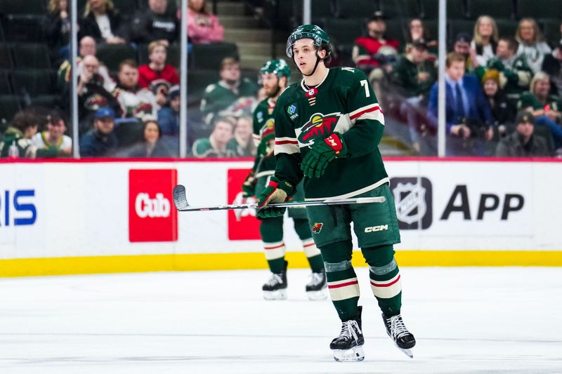 Jan 2, 2024; Saint Paul, Minnesota, USA; Minnesota Wild defenseman Brock Faber (7) reacts following the game against the Calgary Flames at Xcel Energy Center. Mandatory Credit: Brace Hemmelgarn-USA TODAY Sports