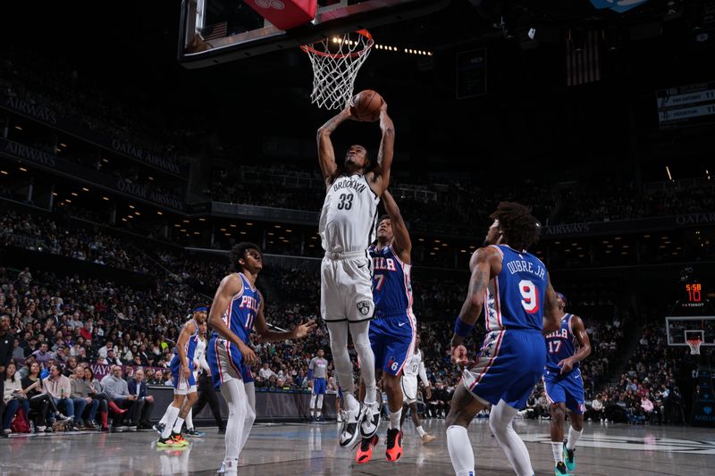 BROOKLYN, NY - MARCH 5: Nicolas Claxton #33 of the Brooklyn Nets drives to the basket during the game against the Philadelphia 76ers on March 5, 2024 at Barclays Center in Brooklyn, New York. NOTE TO USER: User expressly acknowledges and agrees that, by downloading and or using this Photograph, user is consenting to the terms and conditions of the Getty Images License Agreement. Mandatory Copyright Notice: Copyright 2024 NBAE (Photo by Jesse D. Garrabrant/NBAE via Getty Images)