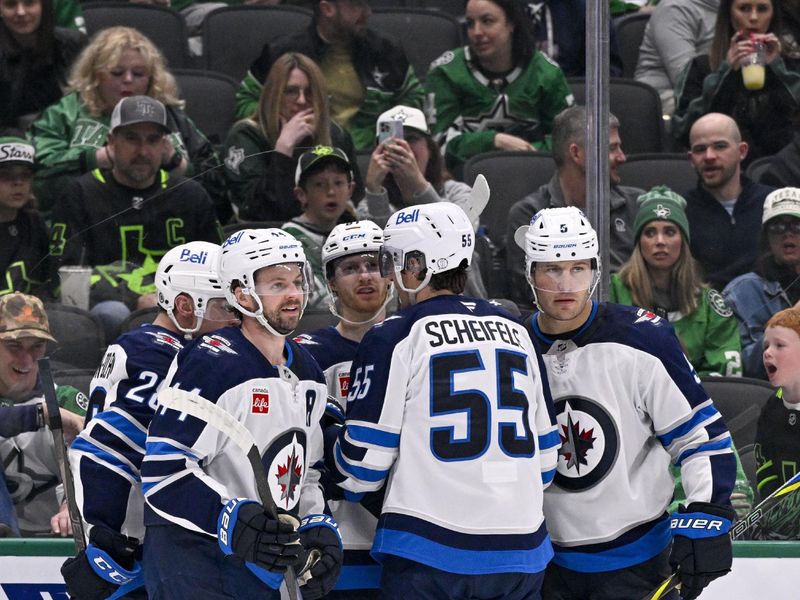 Apr 10, 2025; Dallas, Texas, USA; Winnipeg Jets center Jaret Anderson-Dolan (28) and defenseman Josh Morrissey (44) and center Mark Scheifele (55) and defenseman Luke Schenn (5) celebrates a goal scored by left wing Kyle Connor (81) against the Dallas Stars during the third period at the American Airlines Center. Mandatory Credit: Jerome Miron-Imagn Images