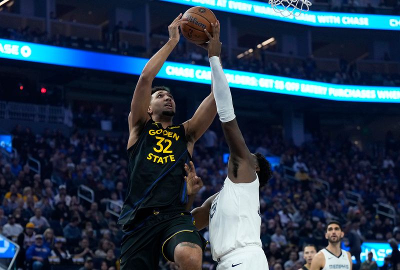 SAN FRANCISCO, CALIFORNIA - NOVEMBER 15: Jaren Jackson Jr. #13 of the Memphis Grizzlies blocks the shot of Trayce Jackson-Davis #32 of the Golden State Warriors in the first quarter during the Emirates NBA Cup game at Chase Center on November 15, 2024 in San Francisco, California. NOTE TO USER: User expressly acknowledges and agrees that, by downloading and or using this photograph, User is consenting to the terms and conditions of the Getty Images License Agreement. (Photo by Thearon W. Henderson/Getty Images)