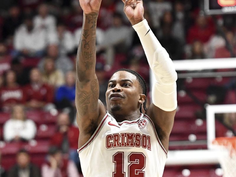 Feb 17, 2024; Tuscaloosa, Alabama, USA;  Alabama Crimson Tide guard Latrell Wrightsell Jr. (12) shoots a three point basket against the Texas A&M Aggies during the second half at Coleman Coliseum. Alabama won 100-75. Mandatory Credit: Gary Cosby Jr.-USA TODAY Sports