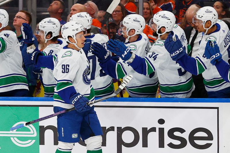 Oct 14, 2023; Edmonton, Alberta, CAN; The Vancouver Canucks celebrate a goal by forward Andrei Kuzmenko (96) during the first period against the Edmonton Oilers at Rogers Place. Mandatory Credit: Perry Nelson-USA TODAY Sports