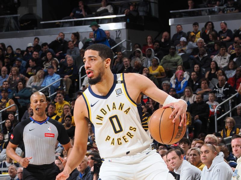 INDIANAPOLIS, IN - MARCH 18:  Tyrese Haliburton #0 of the Indiana Pacers handles the ball during the game  on March 18, 2024 at Gainbridge Fieldhouse in Indianapolis, Indiana. NOTE TO USER: User expressly acknowledges and agrees that, by downloading and or using this Photograph, user is consenting to the terms and conditions of the Getty Images License Agreement. Mandatory Copyright Notice: Copyright 2024 NBAE (Photo by Ron Hoskins/NBAE via Getty Images)