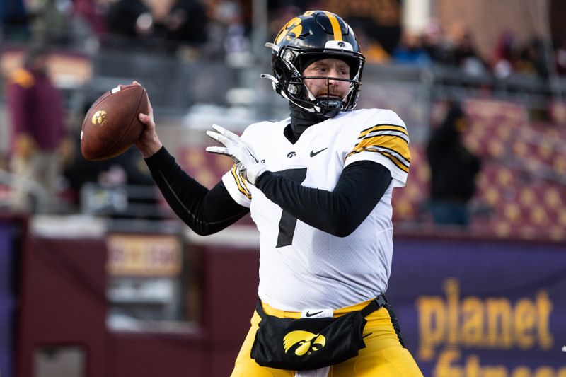 Nov 19, 2022; Minneapolis, Minnesota, USA; Iowa Hawkeyes quarterback Spencer Petras (7) warms up before the game against the Minnesota Golden Gophers at Huntington Bank Stadium. Mandatory Credit: Matt Krohn-USA TODAY Sports