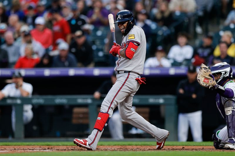 Aug 9, 2024; Denver, Colorado, USA; Atlanta Braves shortstop Orlando Arcia (11) reacts to an inside pitch in the fourth inning against the Colorado Rockies at Coors Field. Mandatory Credit: Isaiah J. Downing-USA TODAY Sports