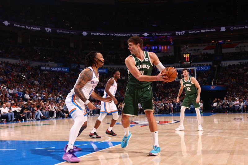 OKLAHOMA CITY, OK - APRIL 12: Brook Lopez #11 of the Milwaukee Bucks handles the ball during the game against the Oklahoma City Thunder on April 12, 2024 at Paycom Arena in Oklahoma City, Oklahoma. NOTE TO USER: User expressly acknowledges and agrees that, by downloading and or using this photograph, User is consenting to the terms and conditions of the Getty Images License Agreement. Mandatory Copyright Notice: Copyright 2024 NBAE (Photo by Zach Beeker/NBAE via Getty Images)