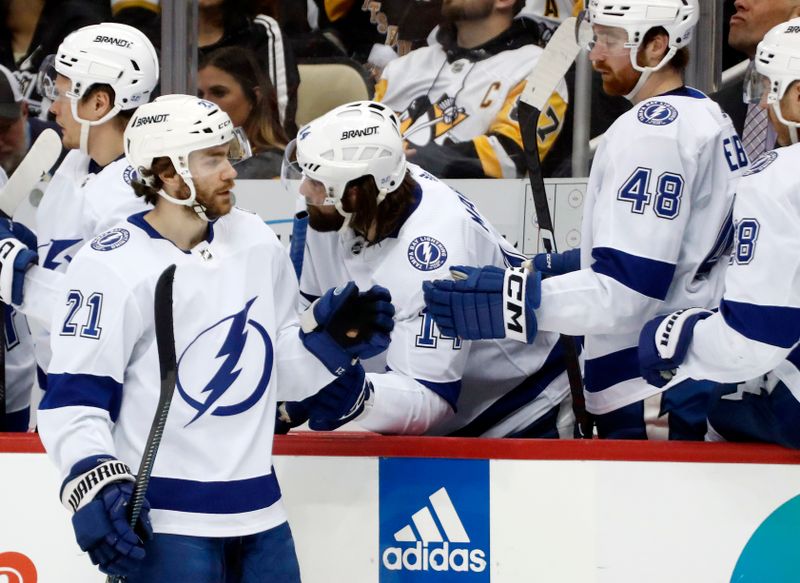 Feb 26, 2023; Pittsburgh, Pennsylvania, USA;  Tampa Bay Lightning center Brayden Point (21) celebrates with the Tampa bench after scoring a goal against the Pittsburgh Penguins during the third period at PPG Paints Arena. The Penguins won 7-3. Mandatory Credit: Charles LeClaire-USA TODAY Sports