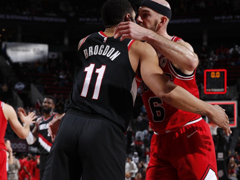 PORTLAND, OR - JANUARY 28: Alex Caruso #6 of the Chicago Bulls embraces Malcolm Brogdon #11 of the Portland Trail Blazers after the game on January 28, 2024 at the Moda Center Arena in Portland, Oregon. NOTE TO USER: User expressly acknowledges and agrees that, by downloading and or using this photograph, user is consenting to the terms and conditions of the Getty Images License Agreement. Mandatory Copyright Notice: Copyright 2024 NBAE (Photo by Cameron Browne/NBAE via Getty Images)