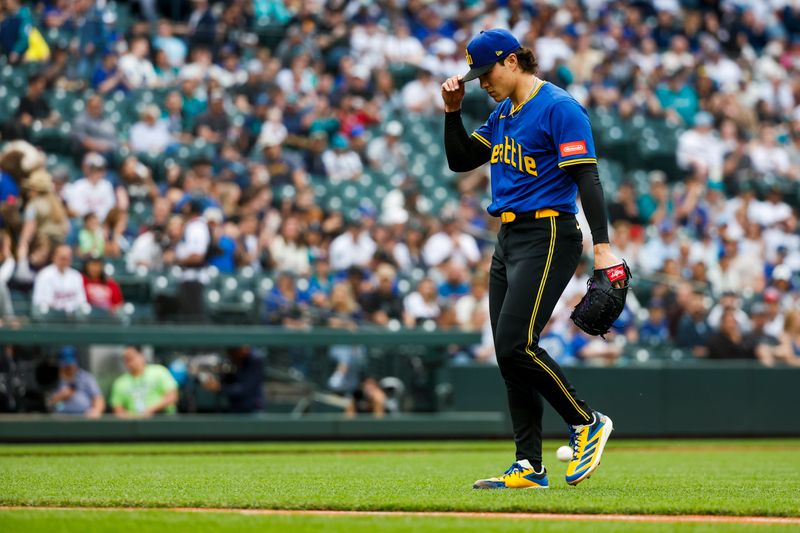 May 30, 2025; Seattle, Washington, USA; Seattle Mariners starting pitcher Bryan Woo (22) walks to the dugout following the top of the first inning against the Minnesota Twins at T-Mobile Park. Mandatory Credit: Joe Nicholson-Imagn Images