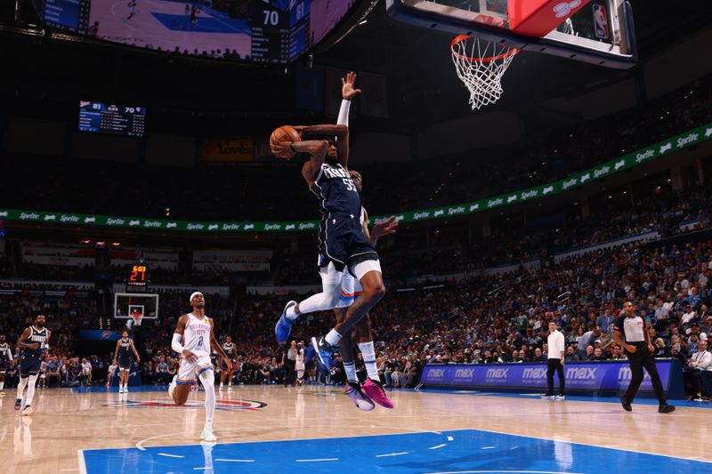 OKLAHOMA CITY, OK - MARCH 14: Derrick Jones Jr. #55 of the Dallas Mavericks drives to the basket during the game against the Oklahoma City Thunder on March 13, 2024 at Paycom Arena in Oklahoma City, Oklahoma. NOTE TO USER: User expressly acknowledges and agrees that, by downloading and or using this photograph, User is consenting to the terms and conditions of the Getty Images License Agreement. Mandatory Copyright Notice: Copyright 2024 NBAE (Photo by Zach Beeker/NBAE via Getty Images)