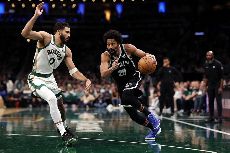 BOSTON, MASSACHUSETTS - NOVEMBER 10: Spencer Dinwiddie #26 of the Brooklyn Nets drives to the basket against Jayson Tatum #0 of the Boston Celtics  during the second hafl of their In-Season Tournament game at TD Garden on November 10, 2023 in Boston, Massachusetts. The Celtics defeat the Nets 121-107. NOTE TO USER: User expressly acknowledges and agrees that, by downloading and or using this photograph, User is consenting to the terms and conditions of the Getty Images License Agreement. (Photo by Maddie Meyer/Getty Images)