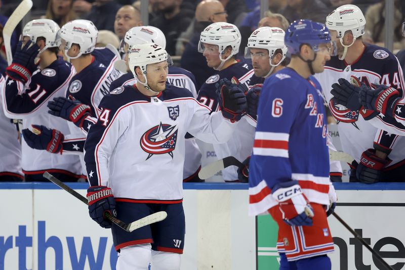 Mar 2, 2026; New York, New York, USA; Columbus Blue Jackets right wing Mathieu Olivier (24) celebrates his goal against the New York Rangers with teammates during the second period at Madison Square Garden. Mandatory Credit: Brad Penner-Imagn Images