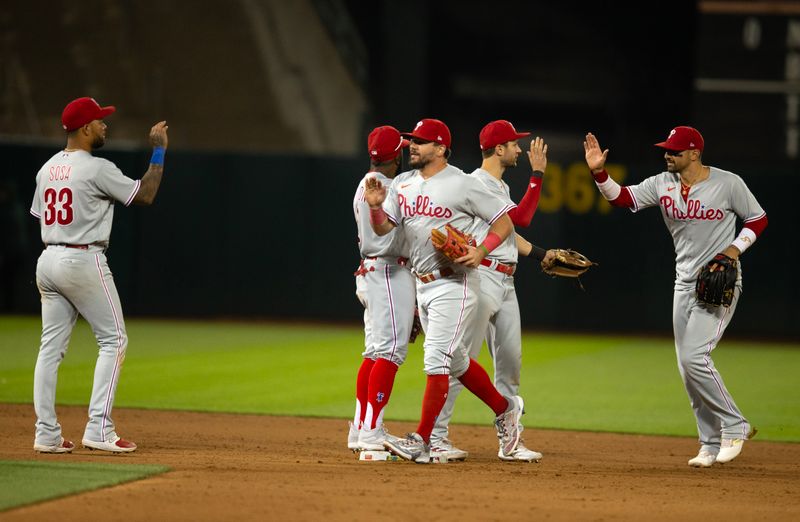 Jun 16, 2023; Oakland, California, USA; Philadelphia Phillies players celebrate their 6-1 victory over the Oakland Athletics at Oakland-Alameda County Coliseum. Mandatory Credit: D. Ross Cameron-USA TODAY Sports