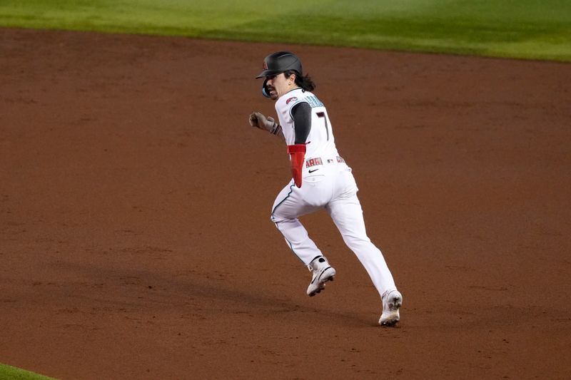 Oct 30, 2023; Phoenix, Arizona, USA; Arizona Diamondbacks left fielder Corbin Carroll (7) runs to second on a wild pitch in the third inning against the Texas Rangers in game three of the 2023 World Series at Chase Field. Mandatory Credit: Joe Camporeale-USA TODAY Sports