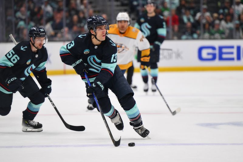 Mar 16, 2024; Seattle, Washington, USA; Seattle Kraken left wing Brandon Tanev (13) advances the puck against the Nashville Predators during the second period at Climate Pledge Arena. Mandatory Credit: Steven Bisig-USA TODAY Sports