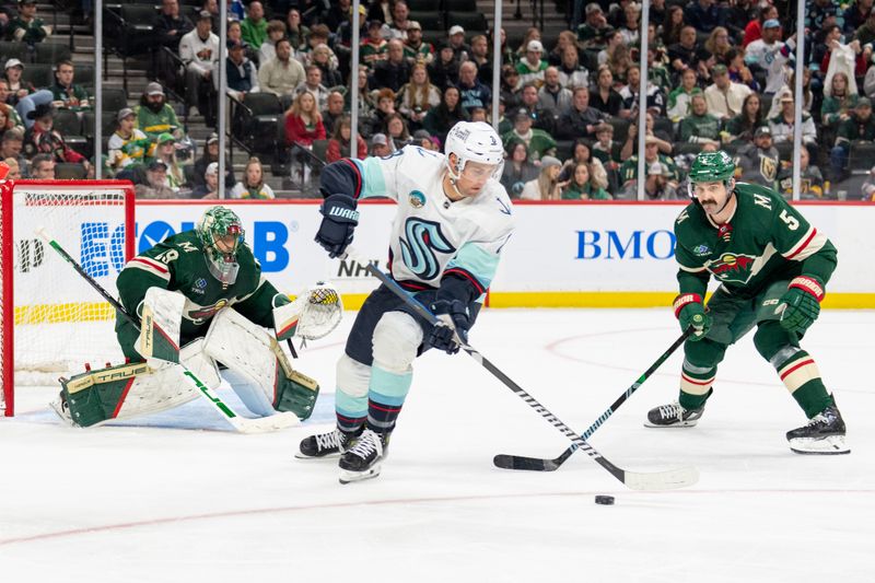 Apr 18, 2024; Saint Paul, Minnesota, USA; Seattle Kraken defenseman Brian Dumoulin (8) skates by Minnesota Wild goaltender Marc-Andre Fleury (29) as defenseman Jake Middleton (5) defends in the third period at Xcel Energy Center. Mandatory Credit: Matt Blewett-USA TODAY Sports