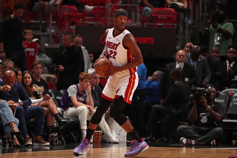 MIAMI, FL - APRIL 12:  Jimmy Butler #22 of the Miami Heat handles the ball during the game against the Toronto Raptors on April 12, 2024 at Kaseya Center in Miami, Florida. NOTE TO USER: User expressly acknowledges and agrees that, by downloading and or using this Photograph, user is consenting to the terms and conditions of the Getty Images License Agreement. Mandatory Copyright Notice: Copyright 2024 NBAE (Photo by Issac Baldizon/NBAE via Getty Images)