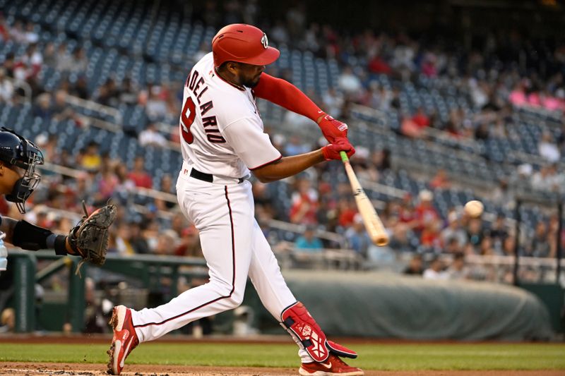 Apr 4, 2023; Washington, District of Columbia, USA; Washington Nationals third baseman Jeimer Candelario (9) hits a single against the Tampa Bay Rays during the first inning at Nationals Park. Mandatory Credit: Brad Mills-USA TODAY Sports